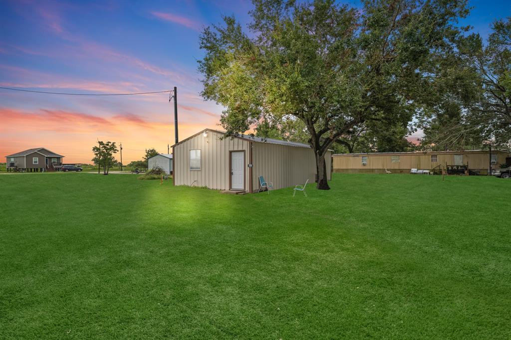 a backyard of a house with lots of green space