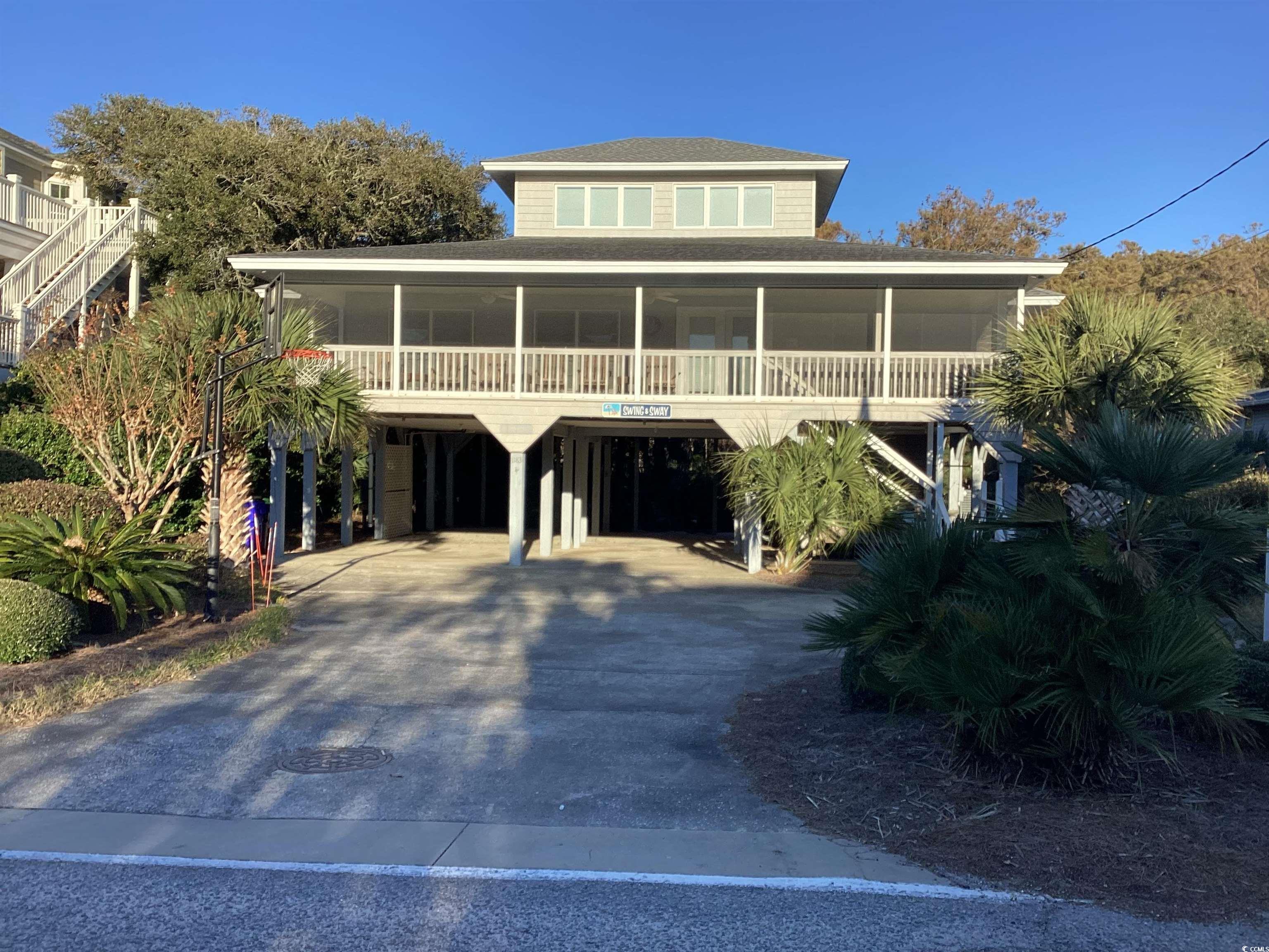 View of front of property featuring a carport