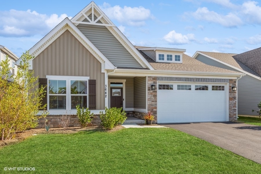 front view of the house with a yard