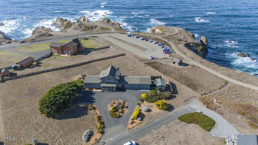 an aerial view of a house with swimming pool