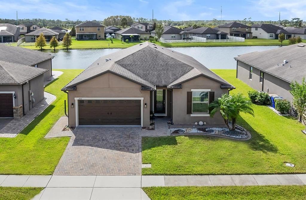 an aerial view of a house with swimming pool