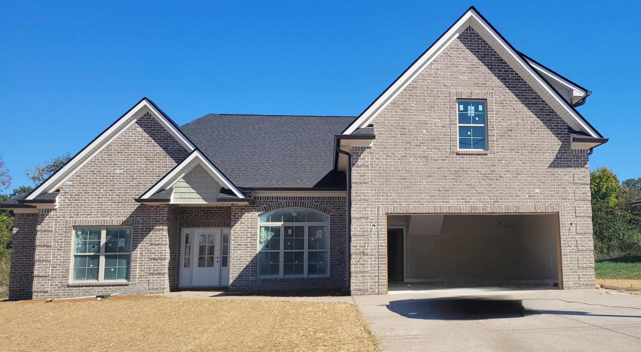 a front view of a house with a yard