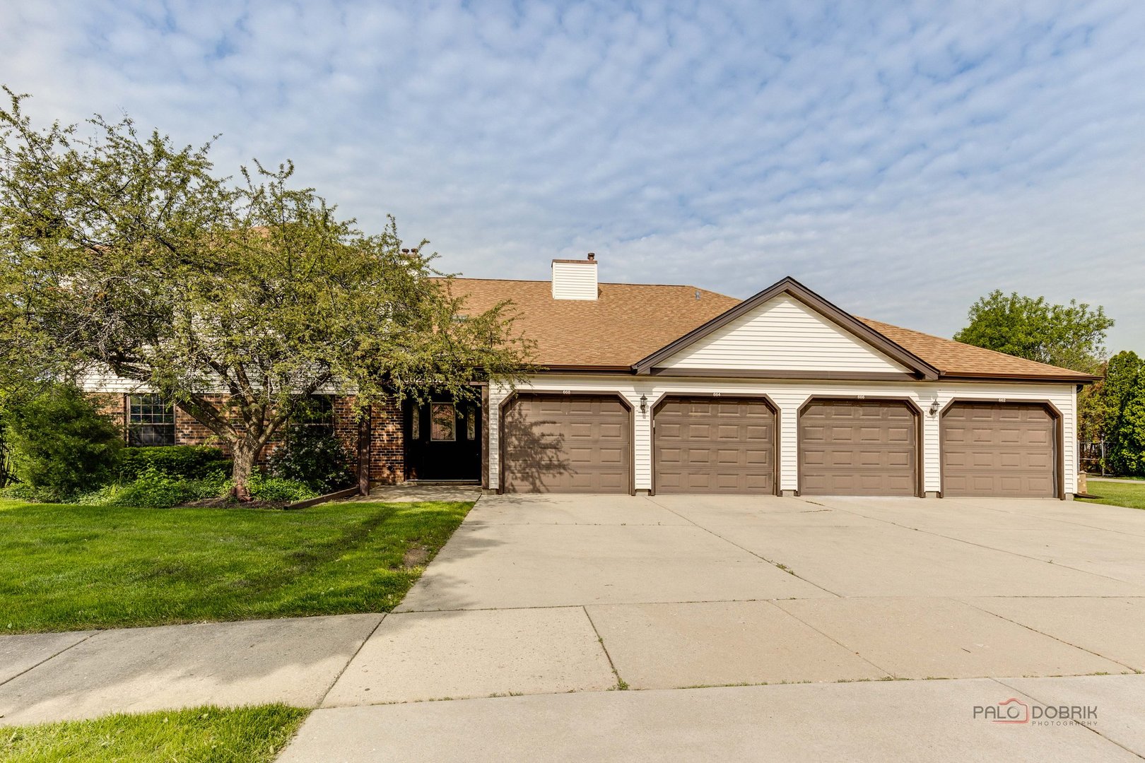 front view of a house with a yard