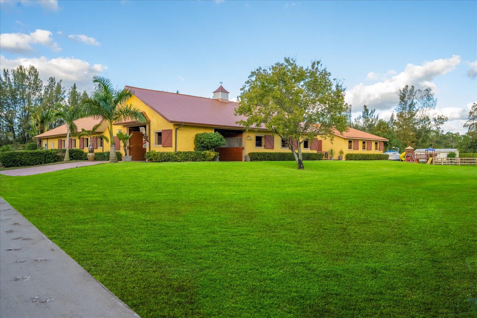 a view of a house with a big yard