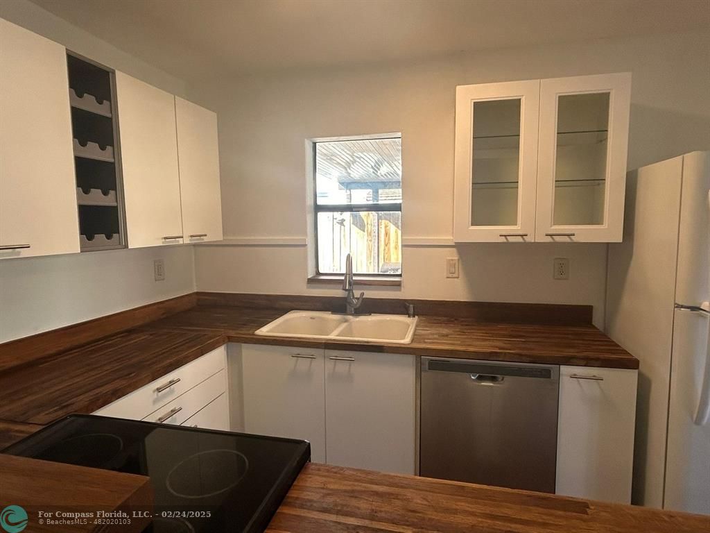 a kitchen with sink and window