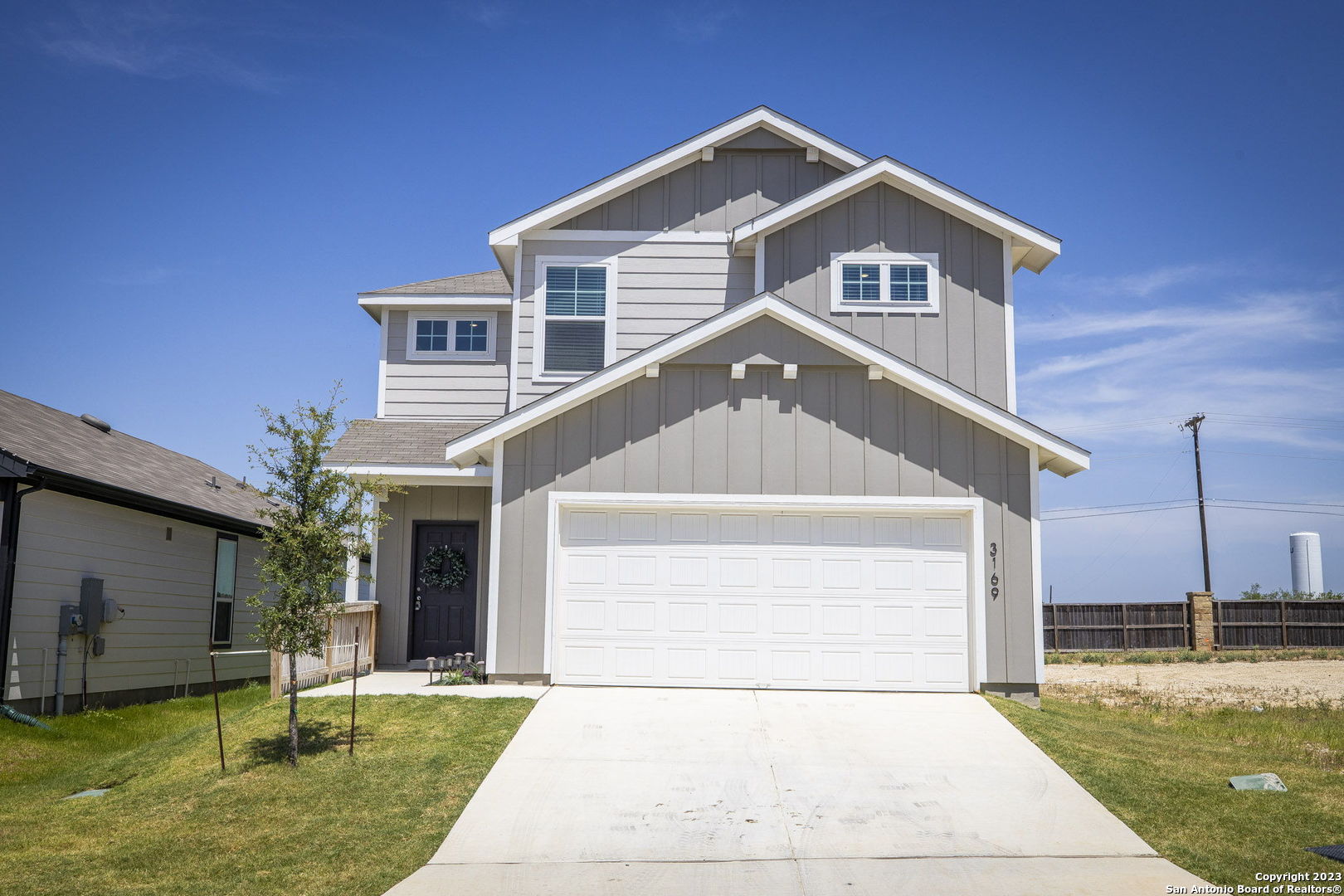 a front view of a house with a yard