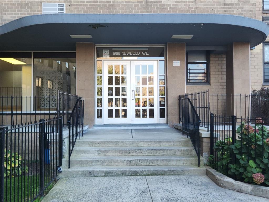 Property entrance featuring french doors