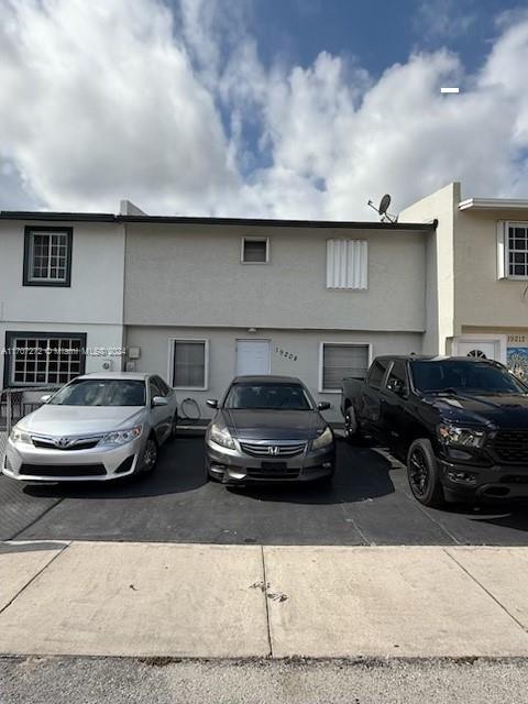 a car parked in front of a house