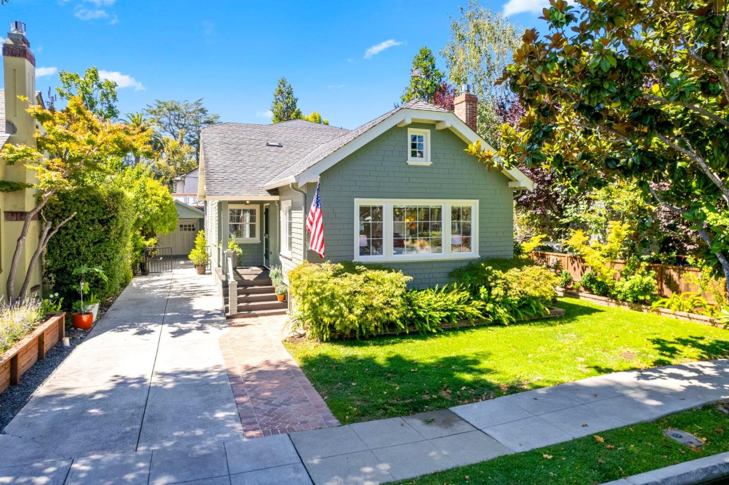 a front view of a house with garden