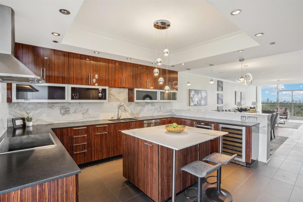 a kitchen with a stove a sink and a refrigerator