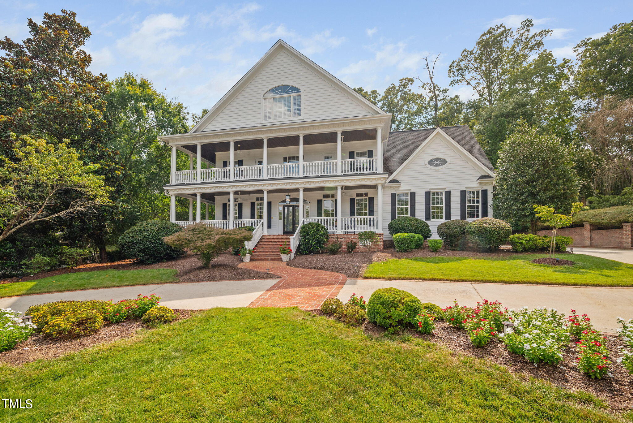 a front view of a house with swimming pool having outdoor seating