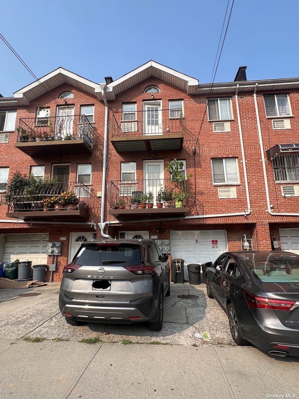 a front view of a house with parking