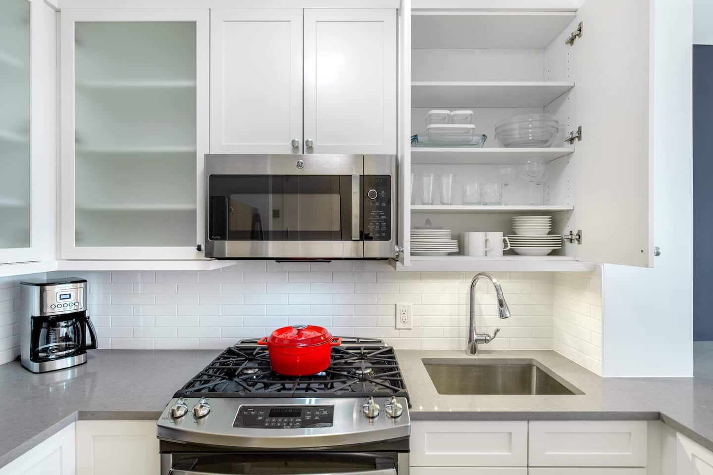 a kitchen with a stove and cabinets