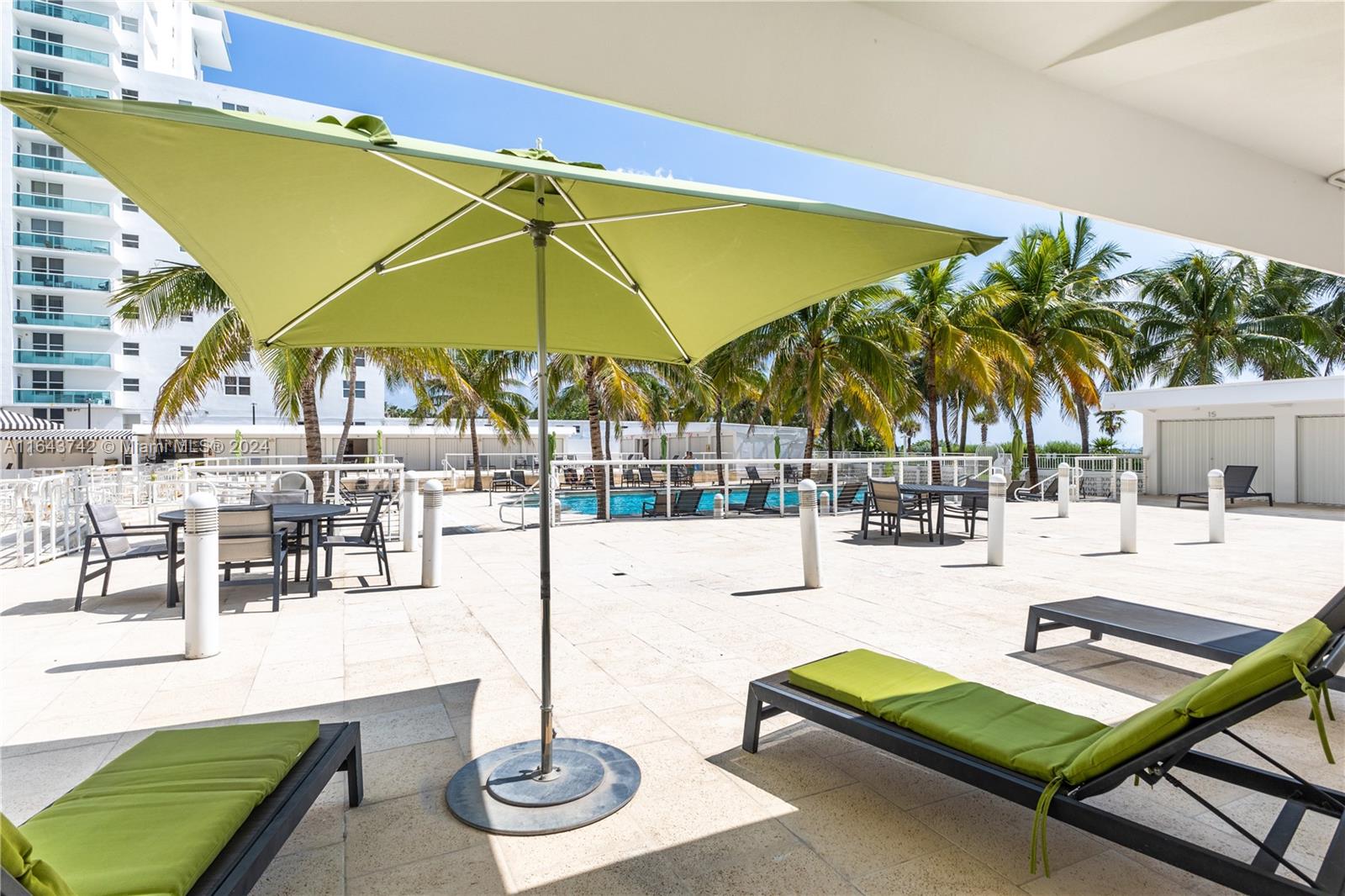 a view of a swimming pool with a lounge chairs