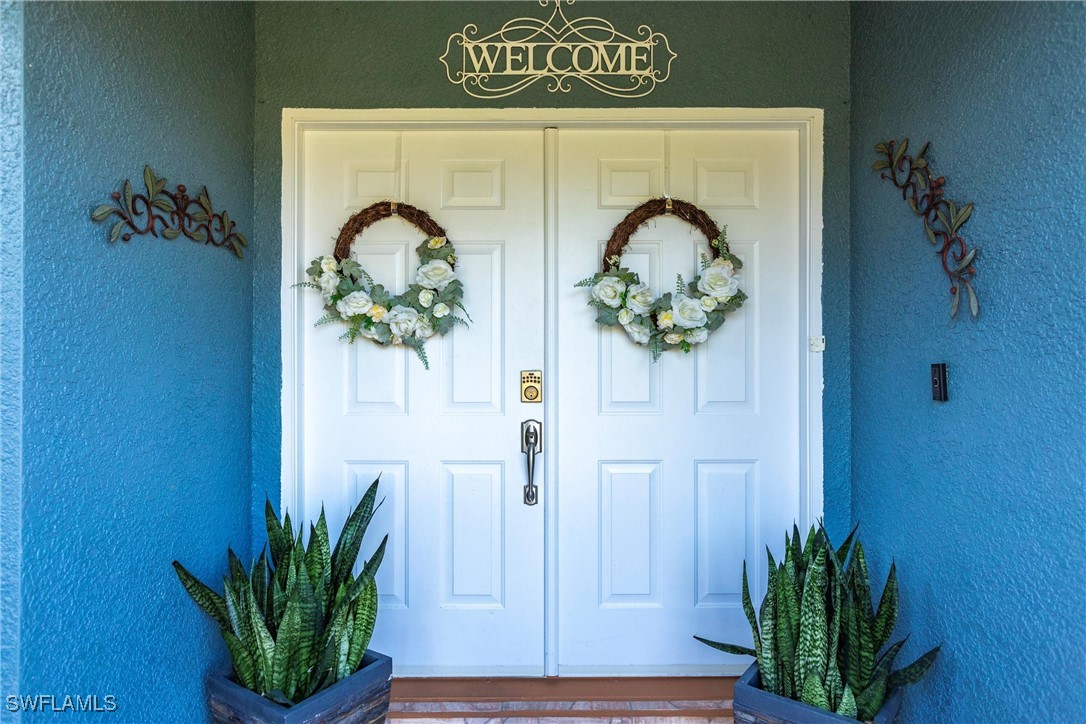 a view of door with wooden door