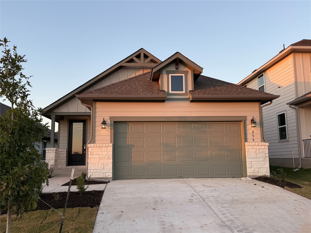 a front view of a house with garage