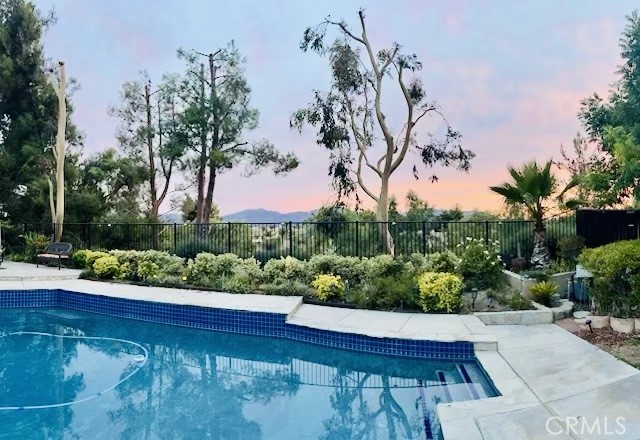 a view of a swimming pool with a patio