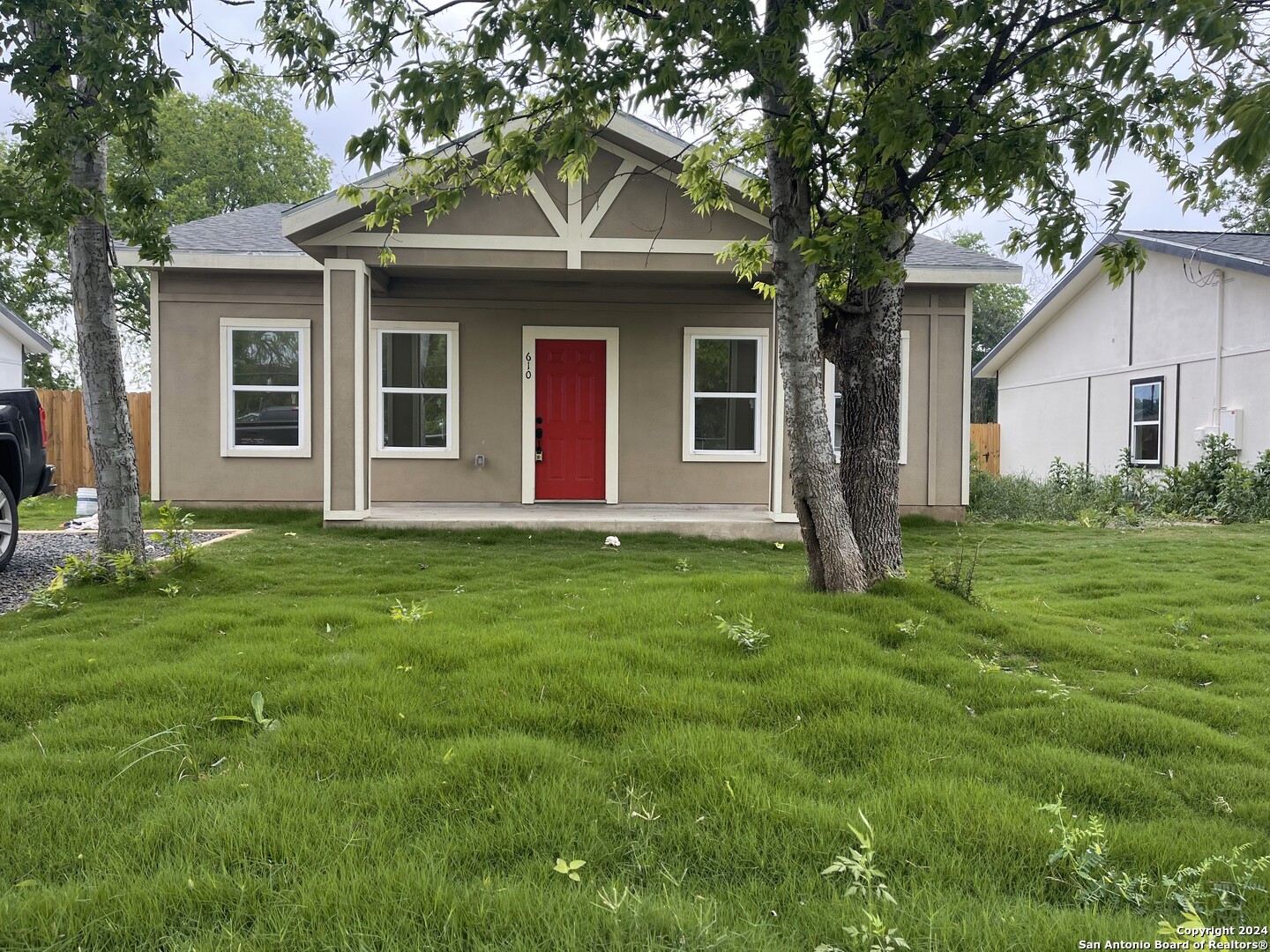 a front view of house with yard and green space