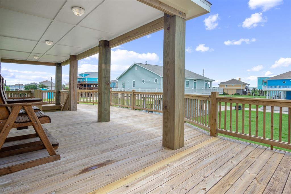 a view of a balcony with wooden floor