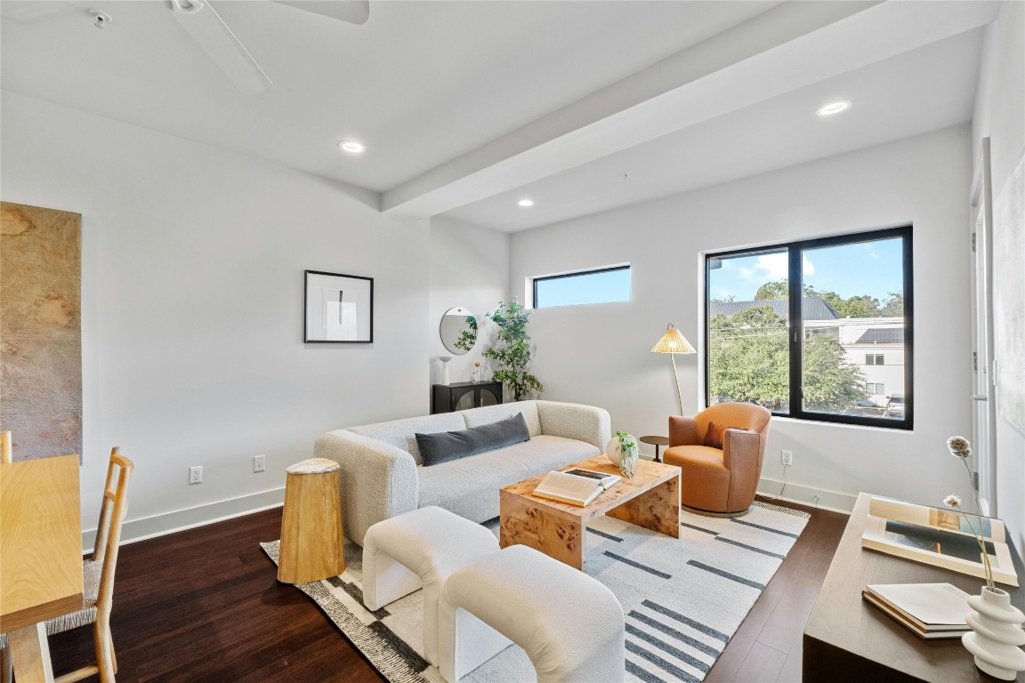 a living room with furniture and a window