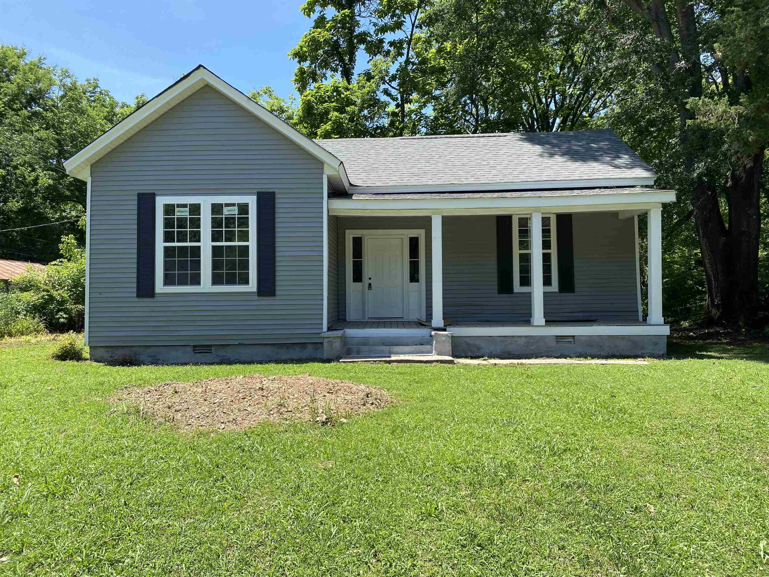 front view of a house with a yard