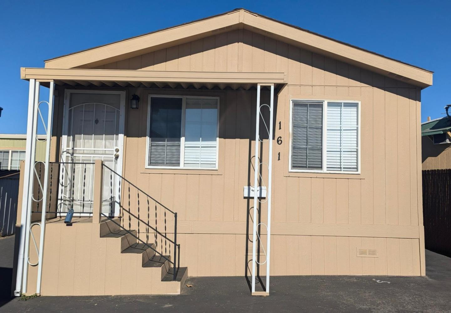 a front view of a house with a small yard