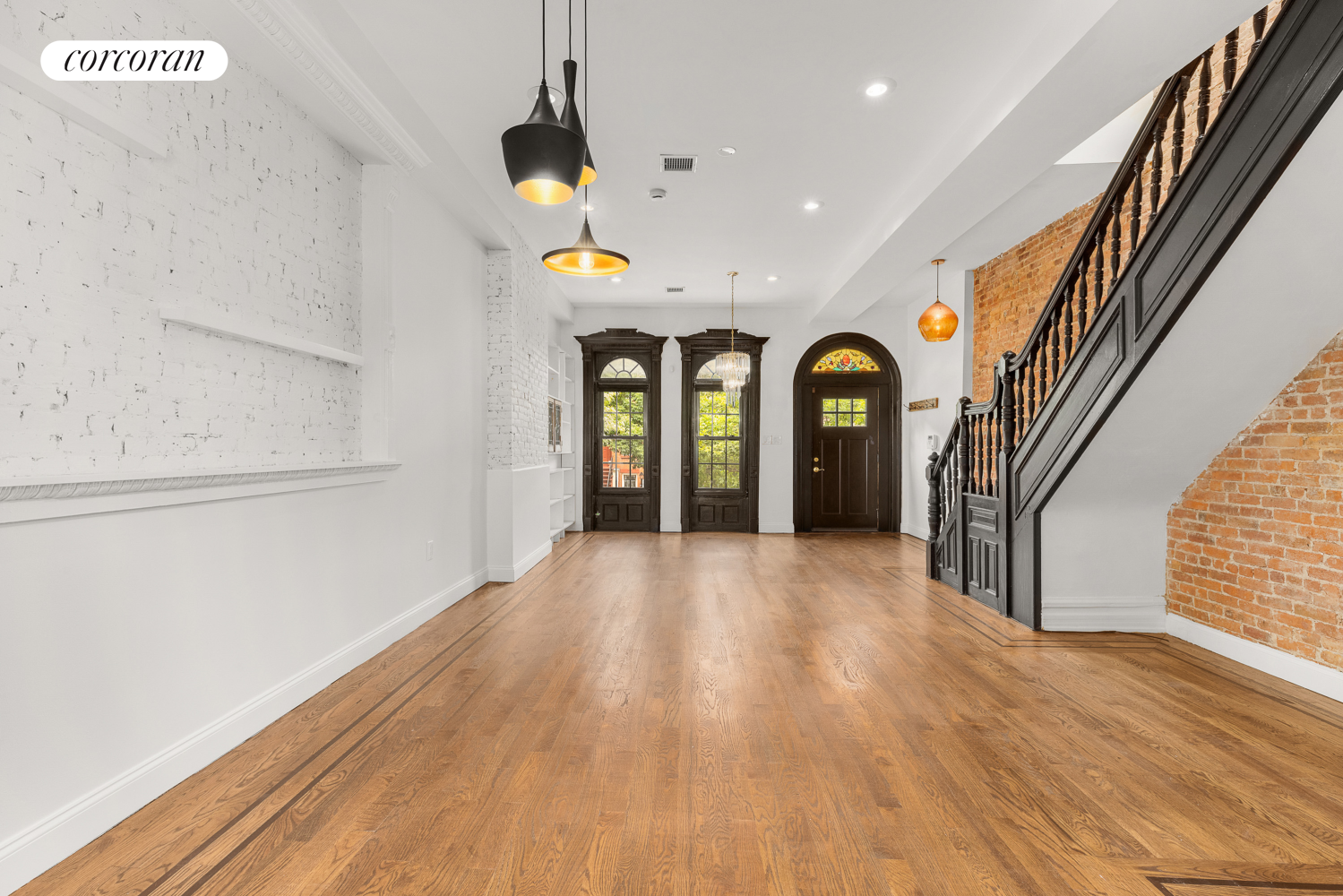 a view of entryway with wooden floor