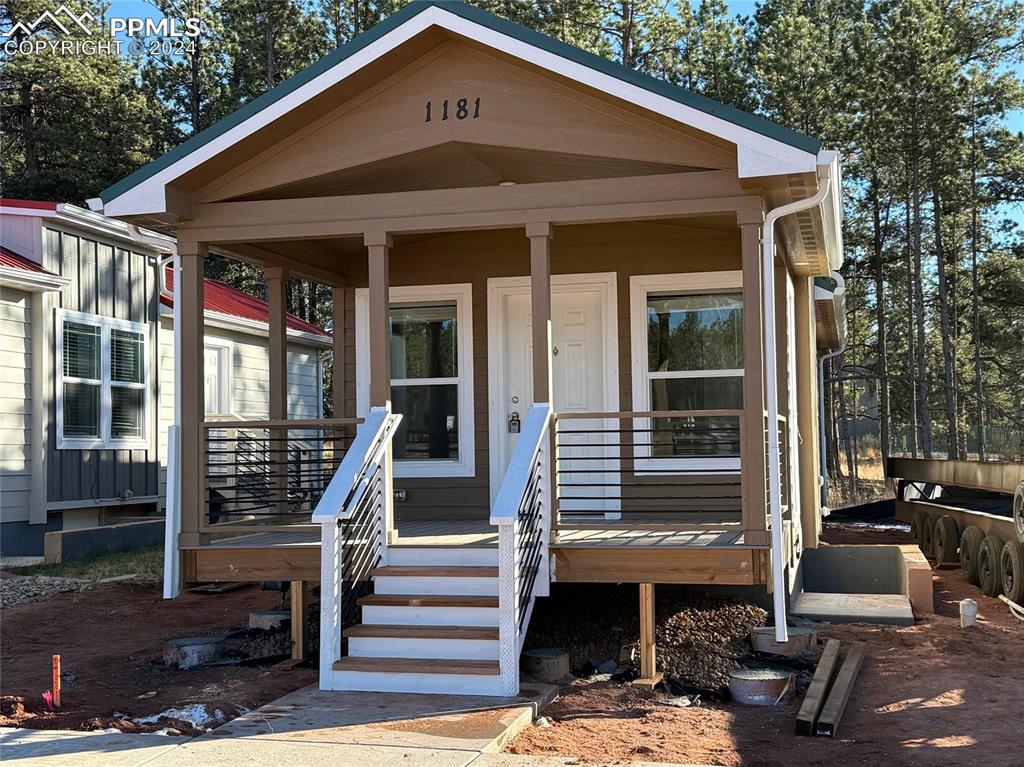 a front view of a house with a porch