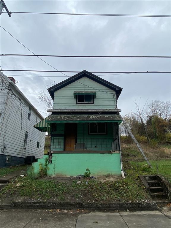 a front view of a house with garage and garage