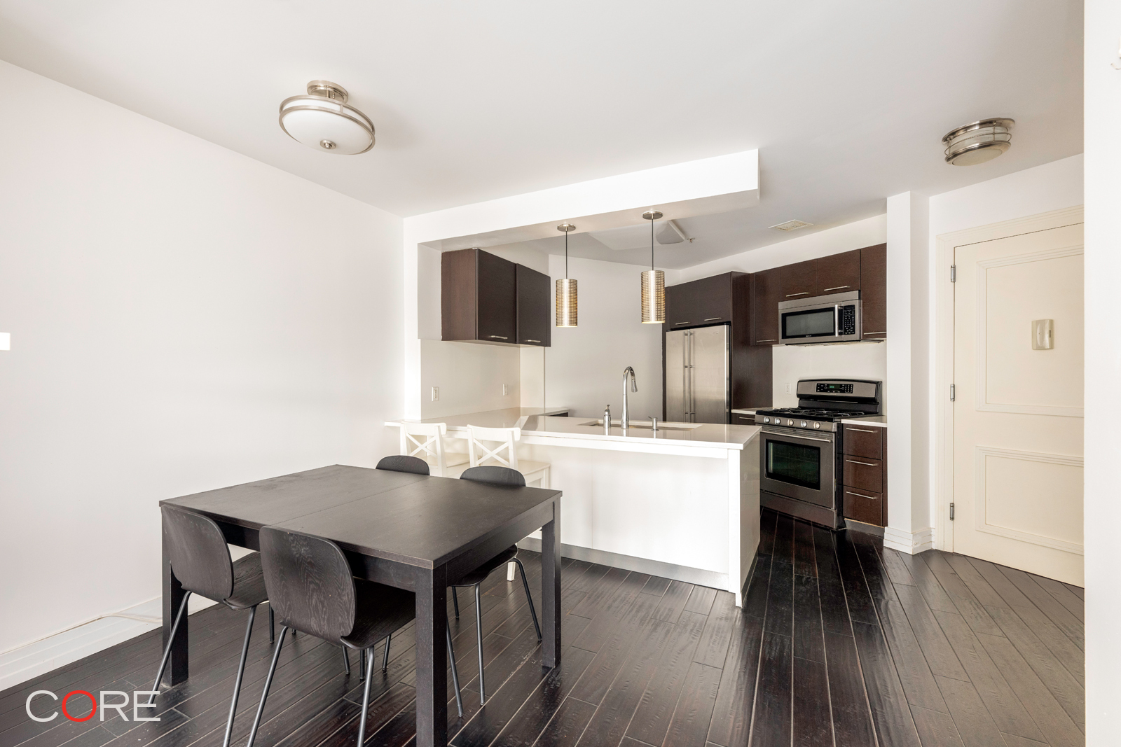 a kitchen with a table and chairs in it