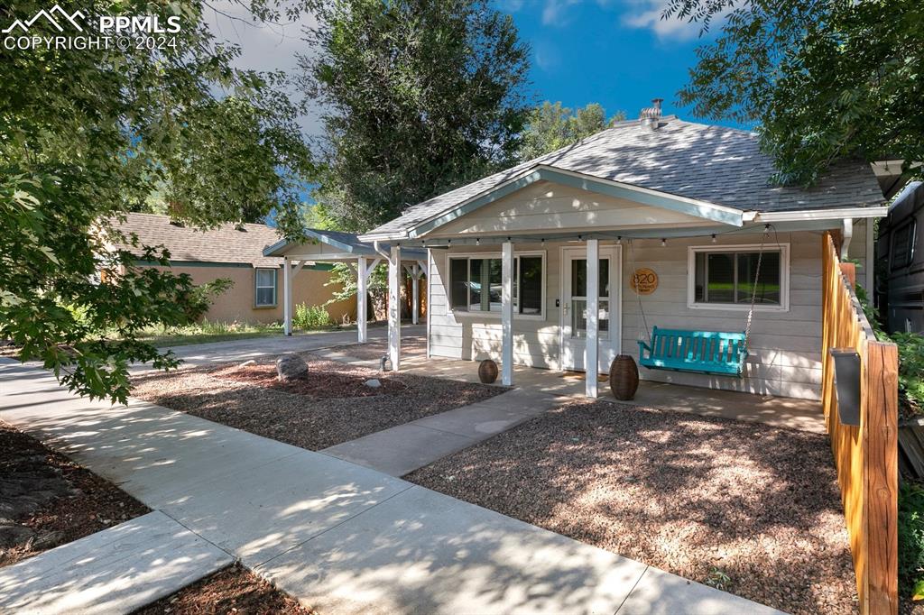 a front view of a house with yard porch and seating space