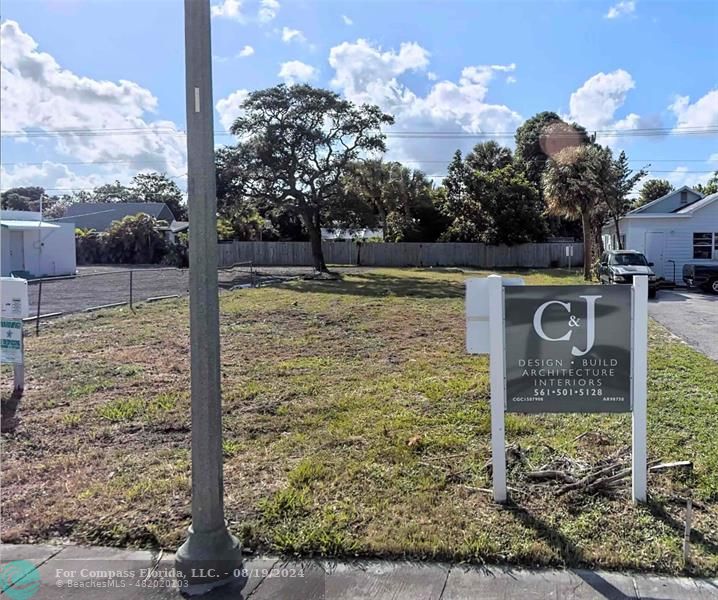 a sign board with a yard