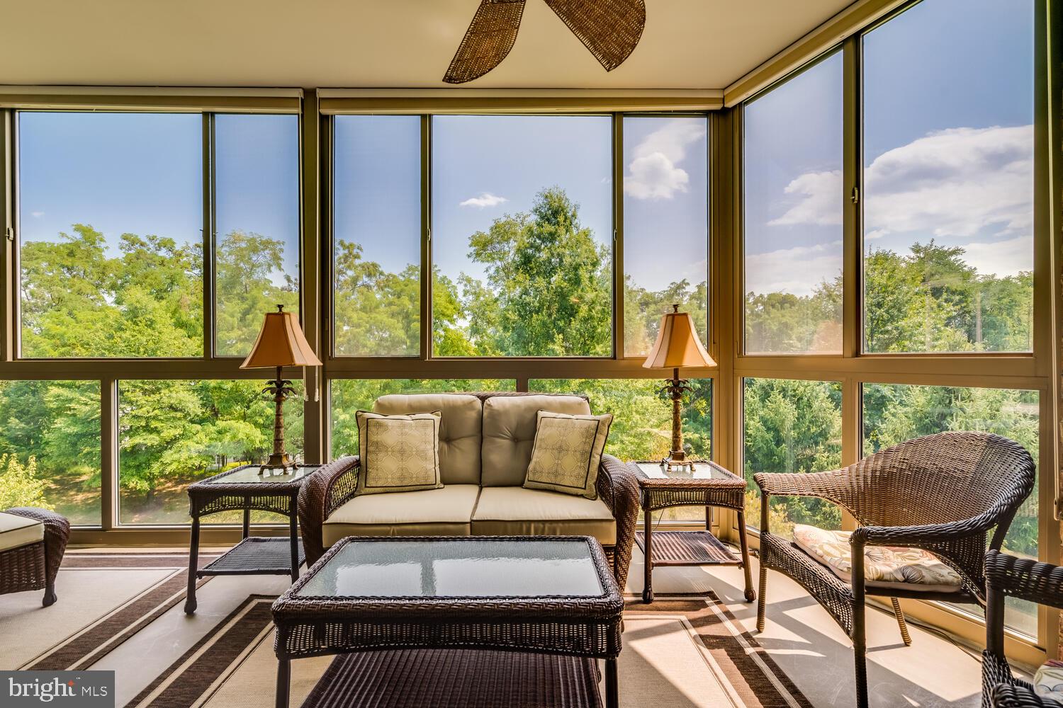 a roof deck with table and chairs