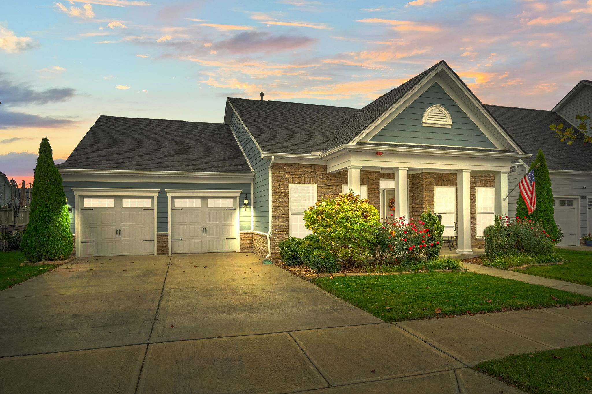 a front view of a house with garden