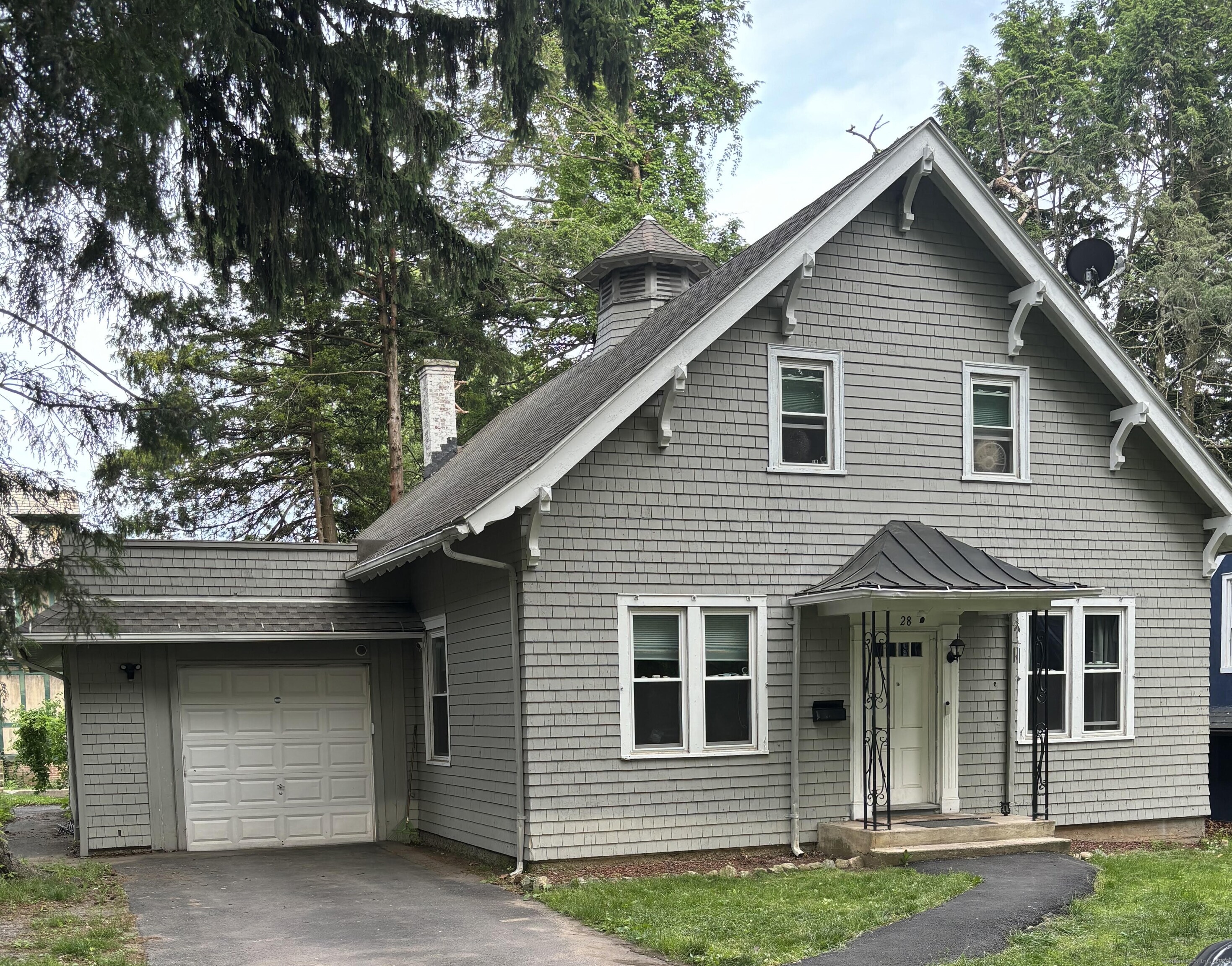 a front view of a house with a garage