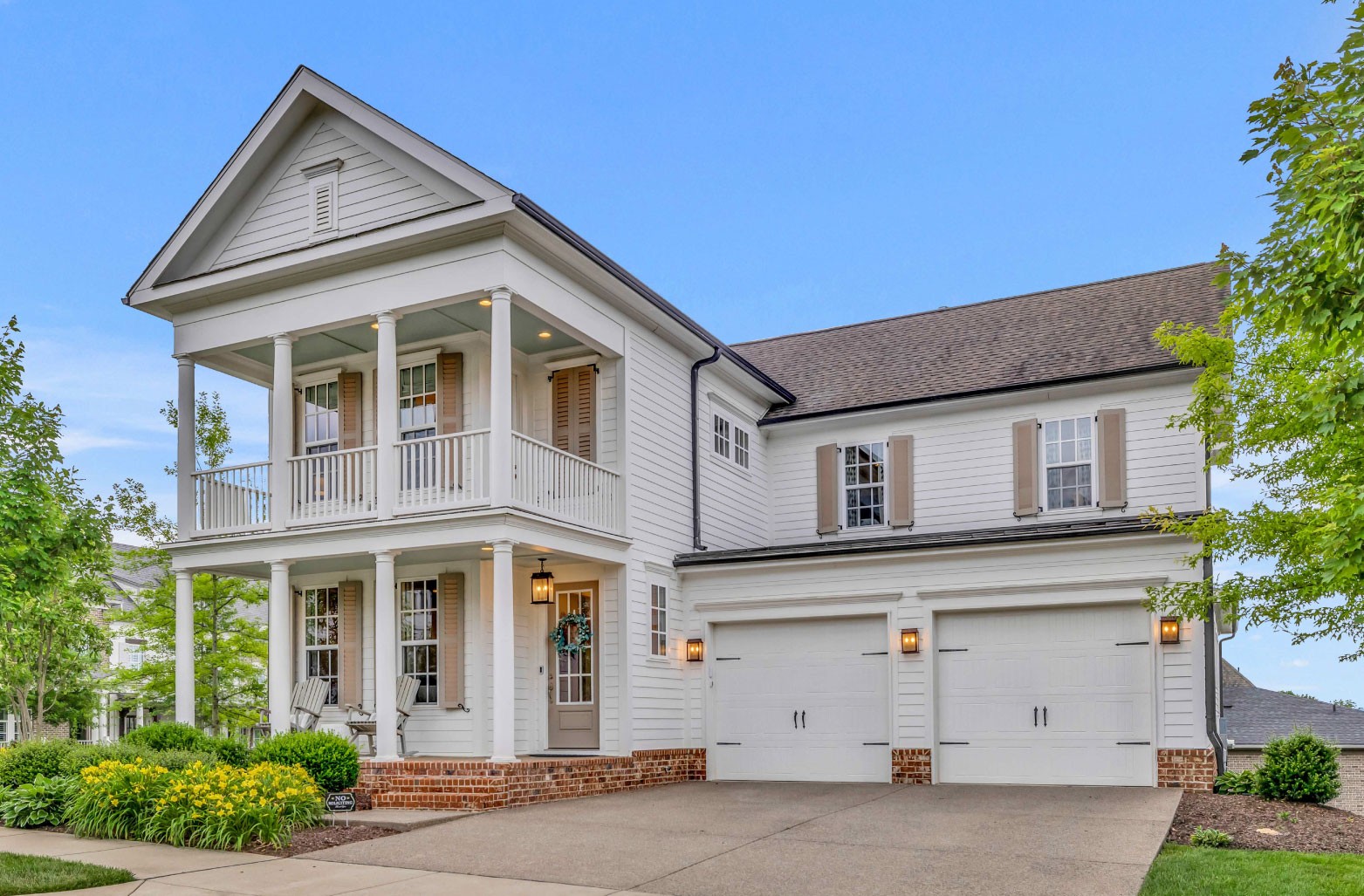 a front view of a house with a garage