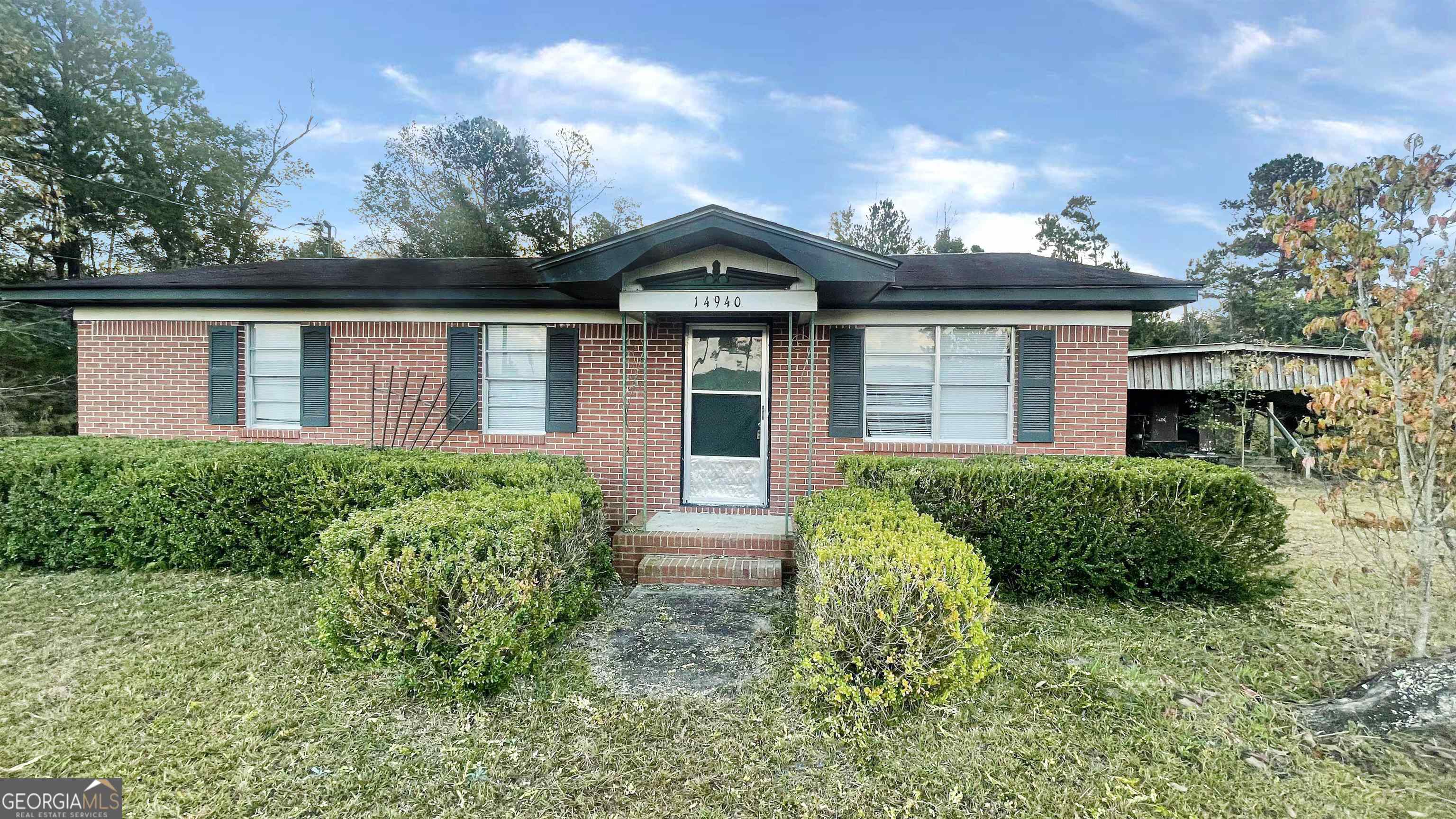 front view of a house with a yard