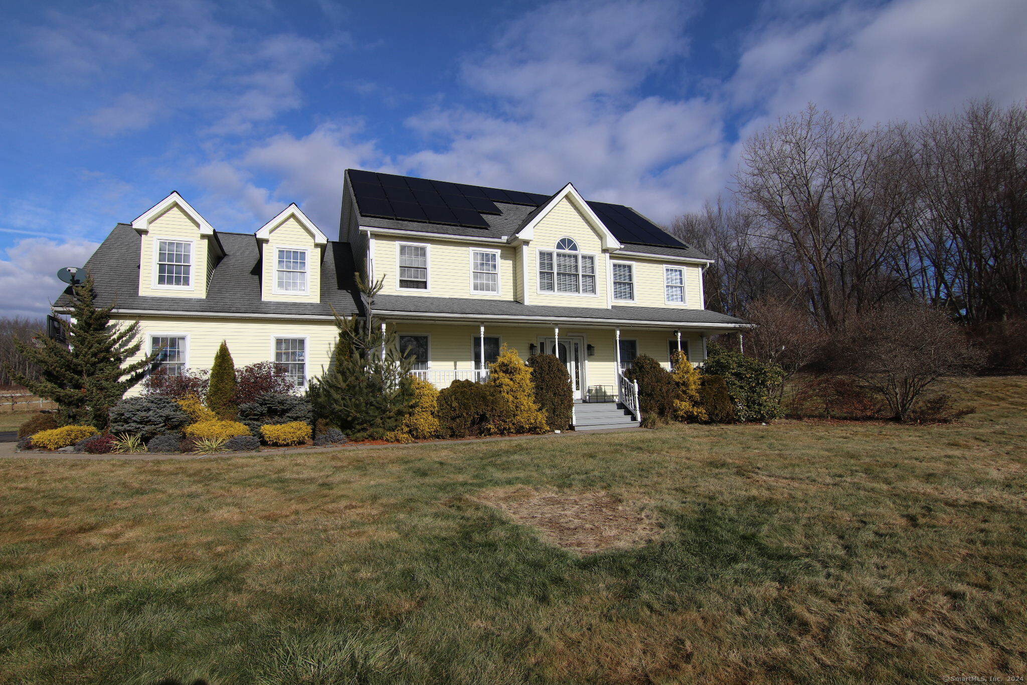 a front view of a house with a yard