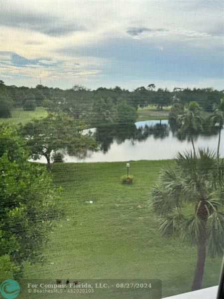 a view of a lake with houses in the back