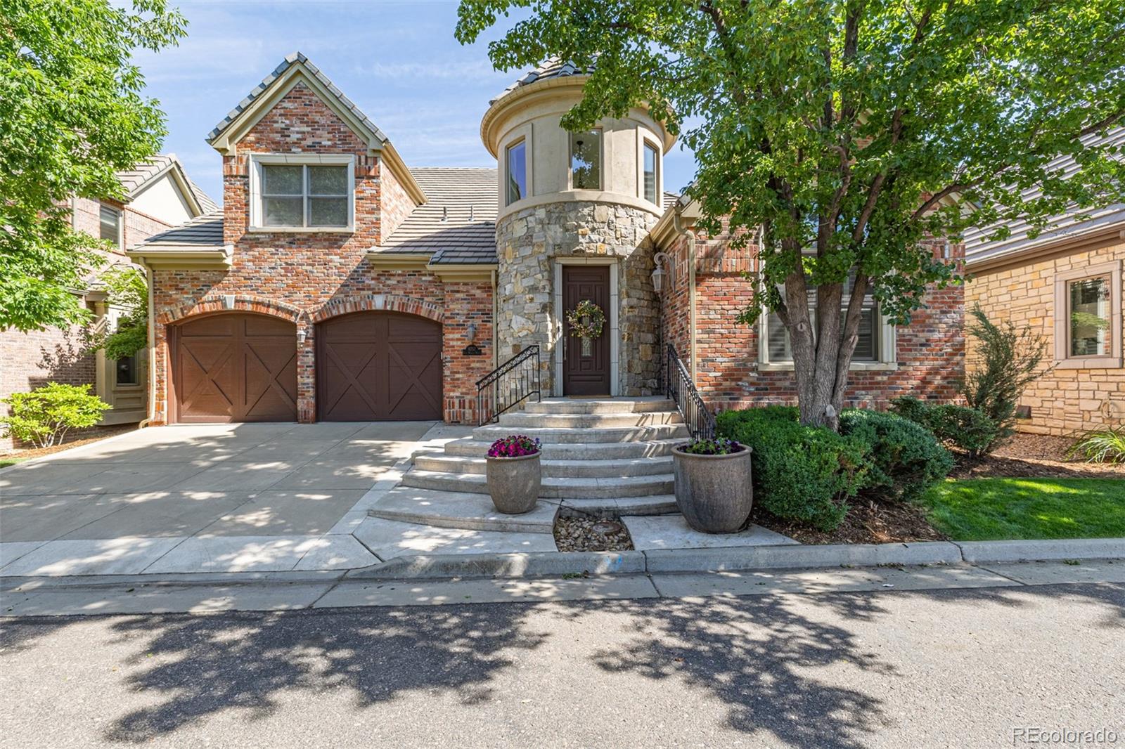 a front view of a house with garage