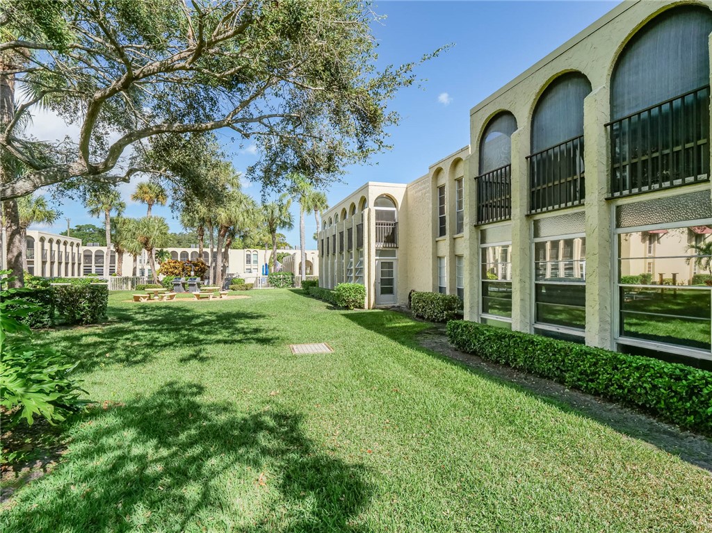 a view of a building with a yard