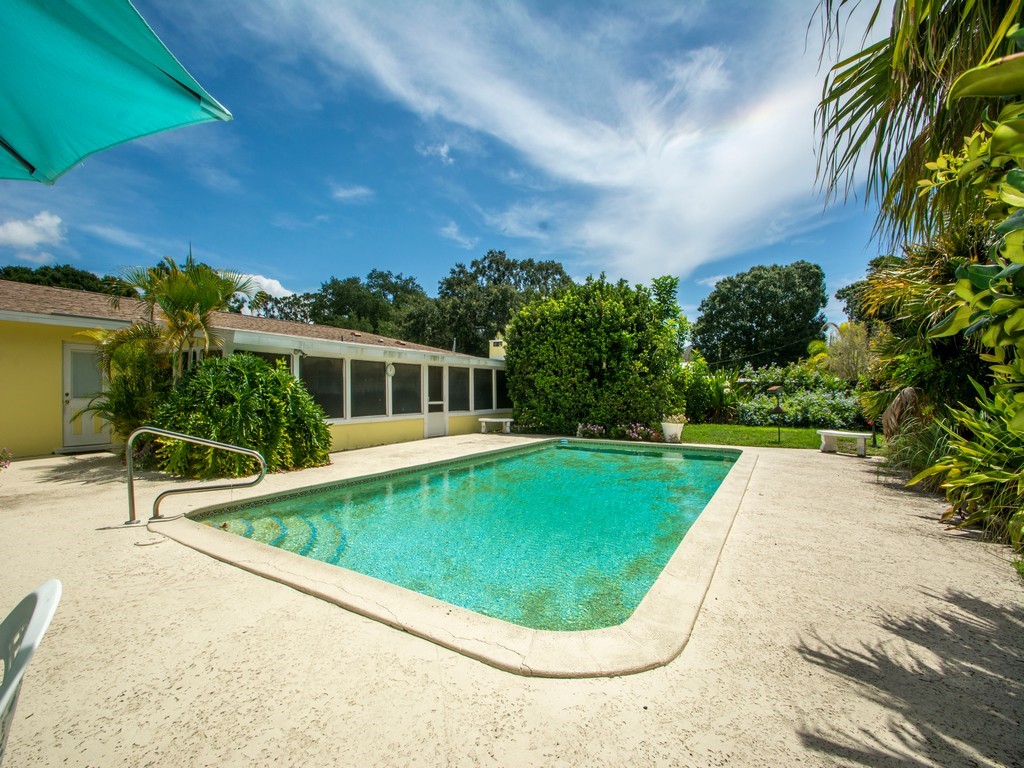 a view of swimming pool with a garden