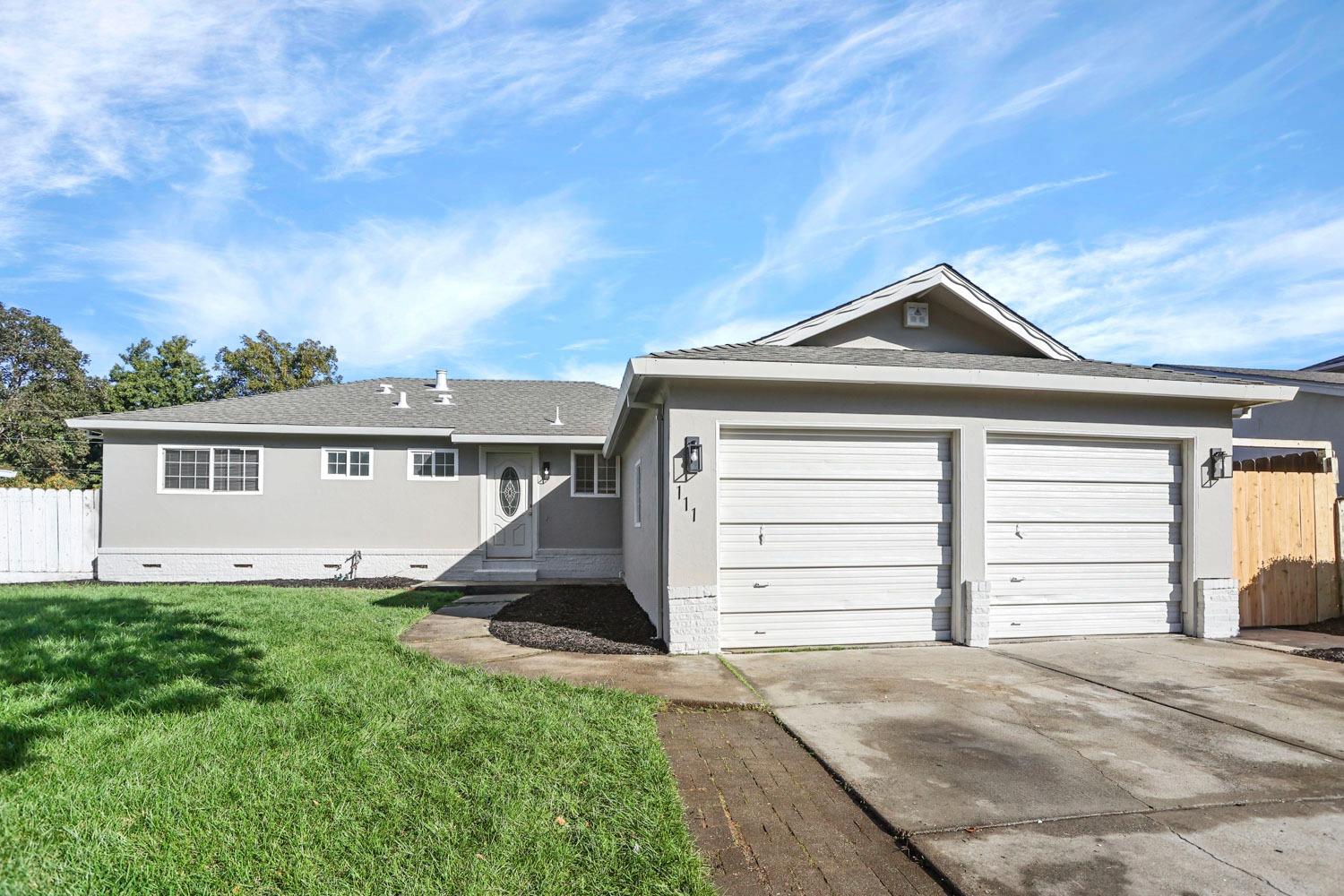 front view of a house with a yard