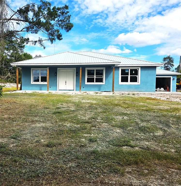 a front view of a house with yard