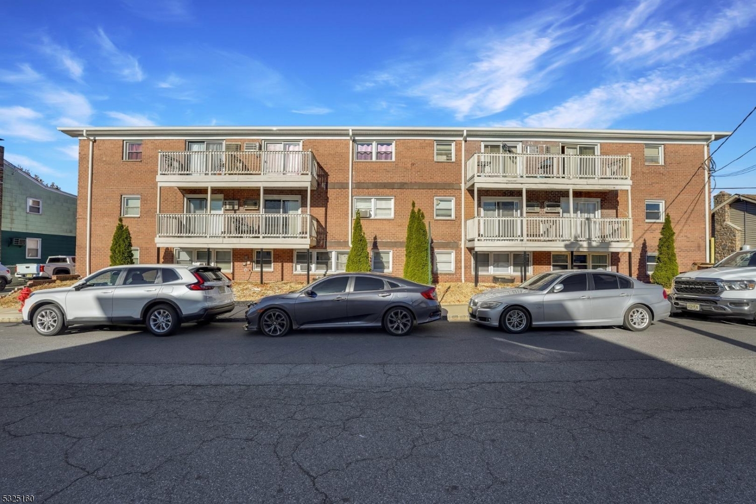 a view of a cars parked in front of a building