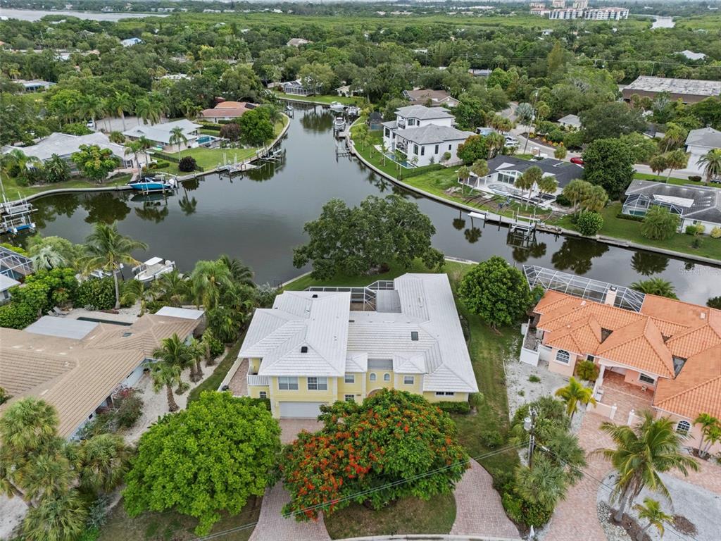 an aerial view of a house with a lake view