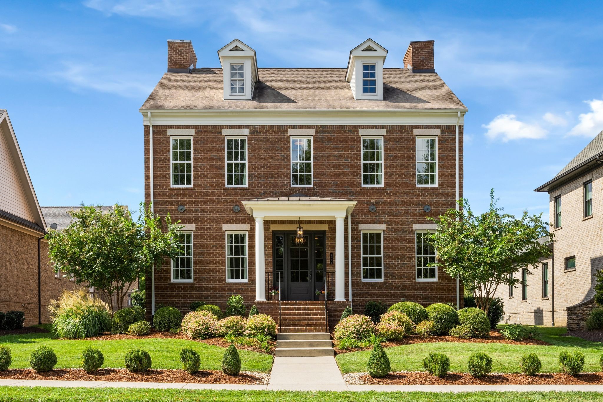 a front view of a house with a yard