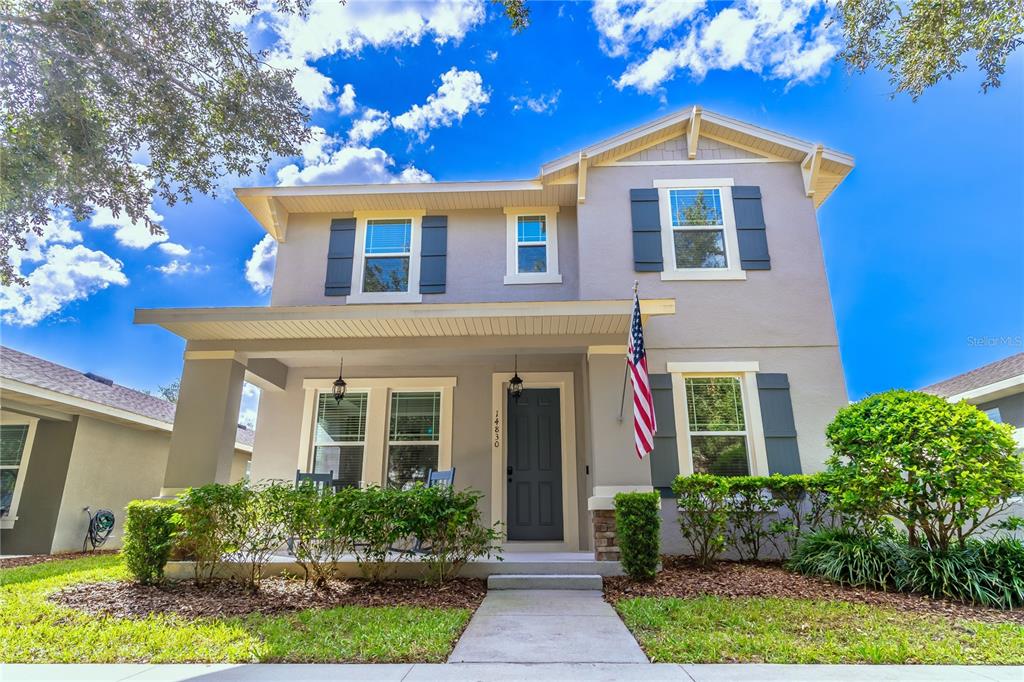 front view of a house with a yard