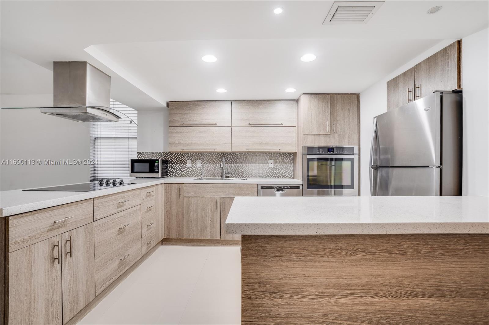 a large kitchen with cabinets