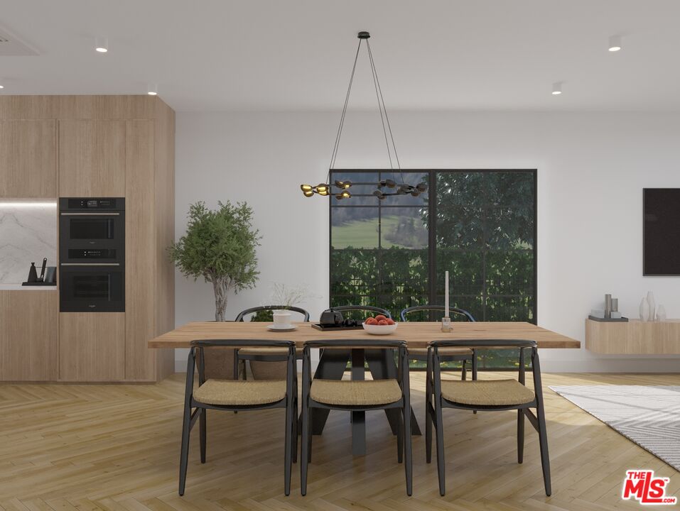 a dining room with furniture and window